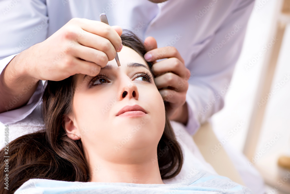 Fototapeta premium Woman visiting doctor cosmetologyst in beauty concept