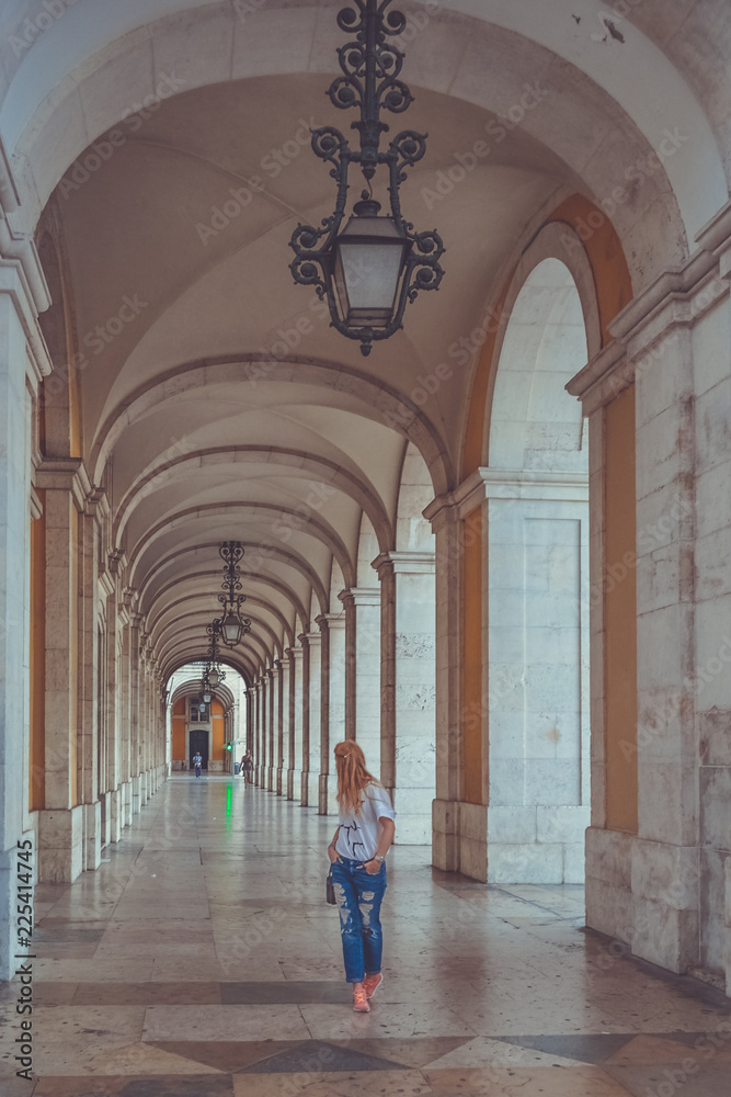 Girl tourist in the Plaza of Commerce Lisbon