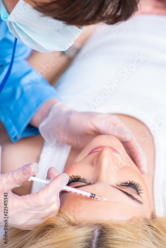Woman visiting doctor for plastic surgery 