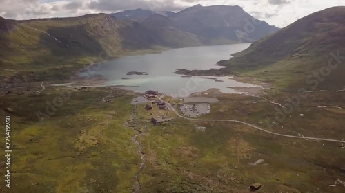 Drone footage over Norwegian fjord and mountain hotel photo