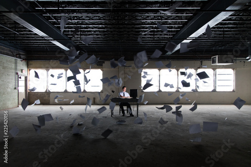 Man working at desk in abandoned building