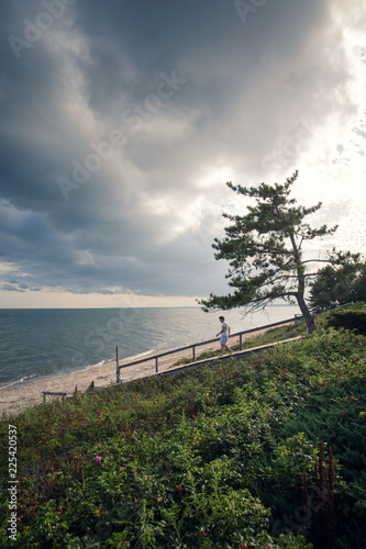 man walking to beach