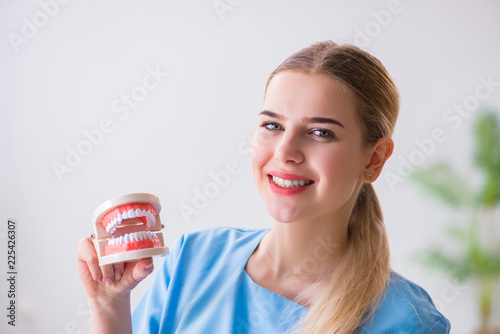Young doctor nurse with dentures
