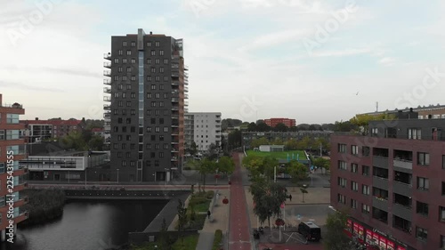 Aerial panoramic view of Geuzenveld-Slotermeer in Amsterdam, The Netherlands, with views of the city early in the morning with drone flying forward photo