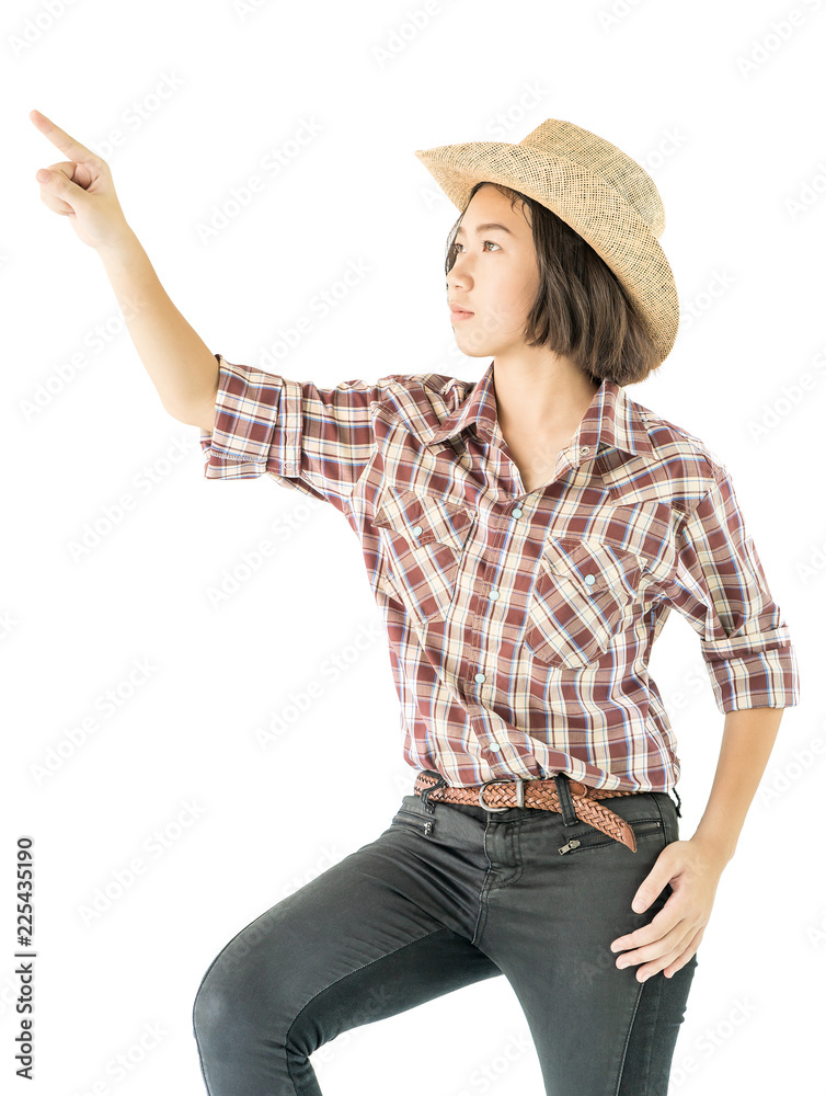 Young woman in a cowboy hat and plaid shirt Young woman in a cowboy hat and plaid shirt