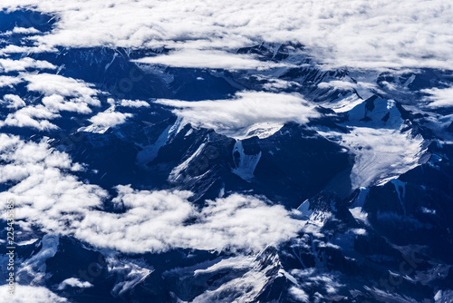 View of snow capped mountain range near Leh city and cloudy sky - Bird's eye view