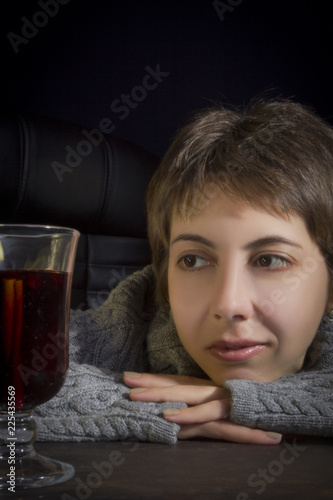 Young woman and hot cocktail