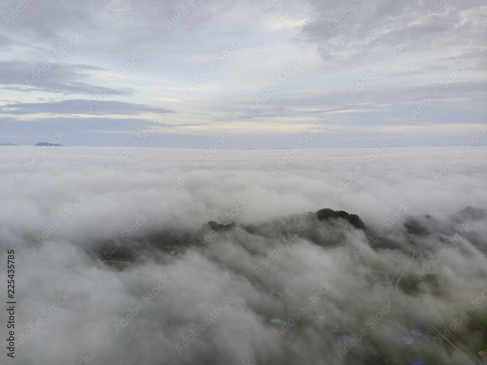 fog covered mountain at morning light fog covered mountain at morning light