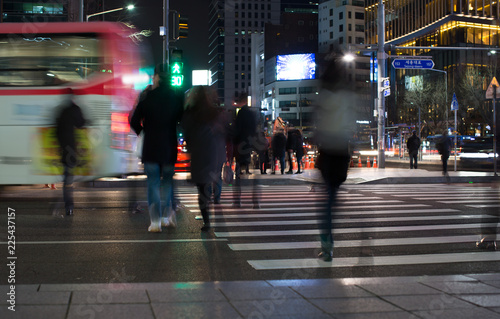 Photography Street Scene with People Crossing the Street at Night