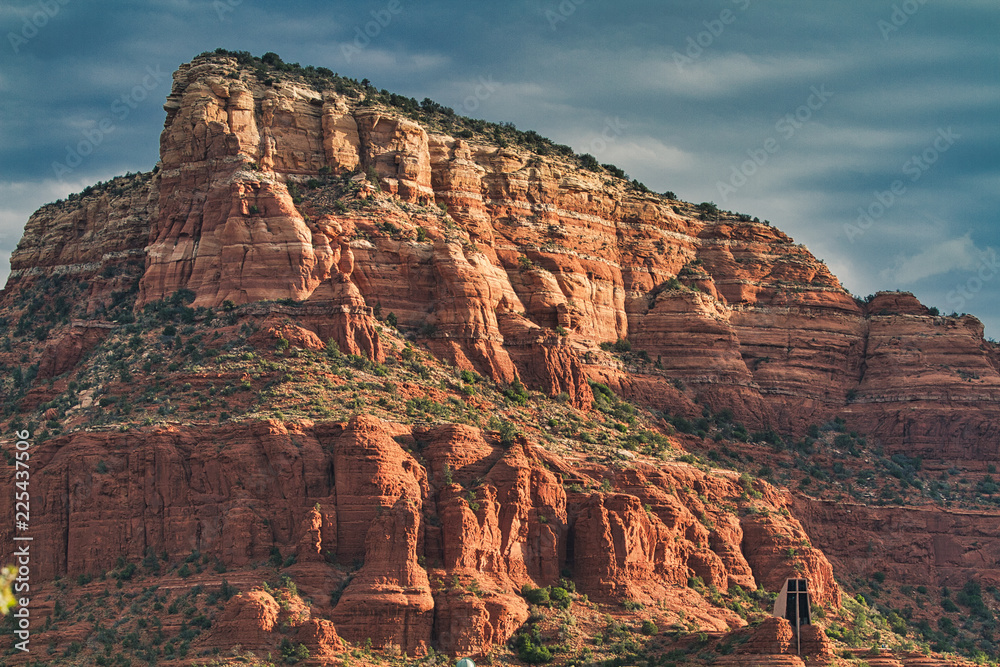 A mesa butte rises above valley floor in Sedona, Arizona (USA)