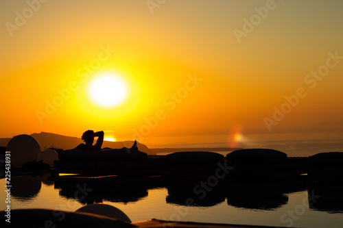 Silhouetted Man watching sunset  Santorini Greece