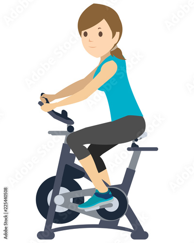 Young Woman doing exercise on static bike
