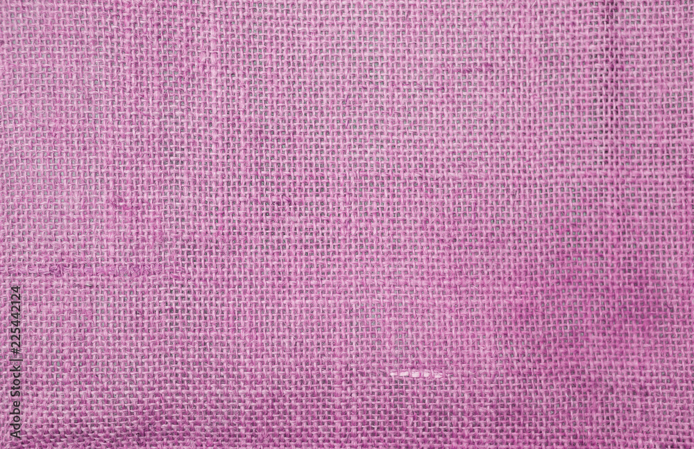 Fototapeta premium Abstract closeup pink hessian texture background, blank pink fiber pattern background