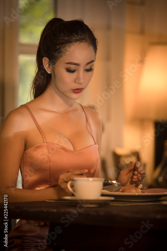 Young asian girl in evening dress dinner under candlelight to night special 