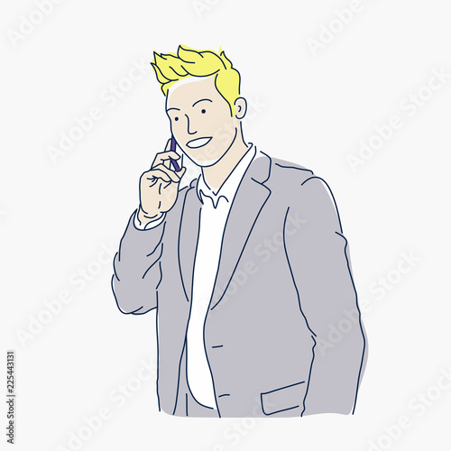 Successful handsome man in a suit with a phone