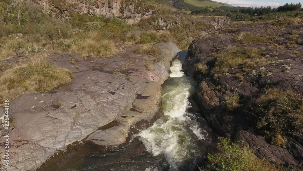 Flying over the Rio Pita running through a channel in an old Andesitic lava flow near Cotopaxi Volcano in the Ecuadorian Andes Flying over the Rio Pita running through a channel in an old Andesitic lava flow near Cotopaxi Volcano in the Ecuadorian Andes