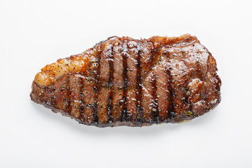 grilled marbled beef steak striploin isolated on white background, top view