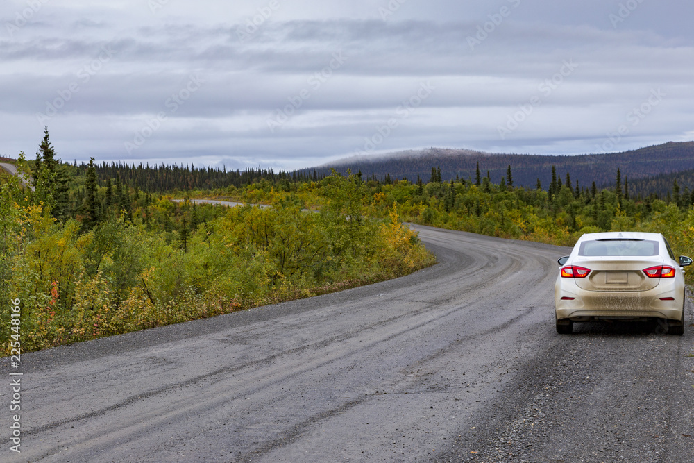 Dirty car on the top of the world higway, the most notherly road between Yukon and Alaska.