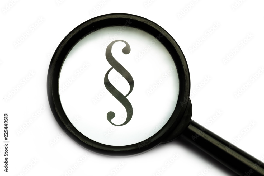Paragraph Symbol Seen Through Magnifying Glass Close-up Paragraph Symbol Seen Through Magnifying Glass Close-up