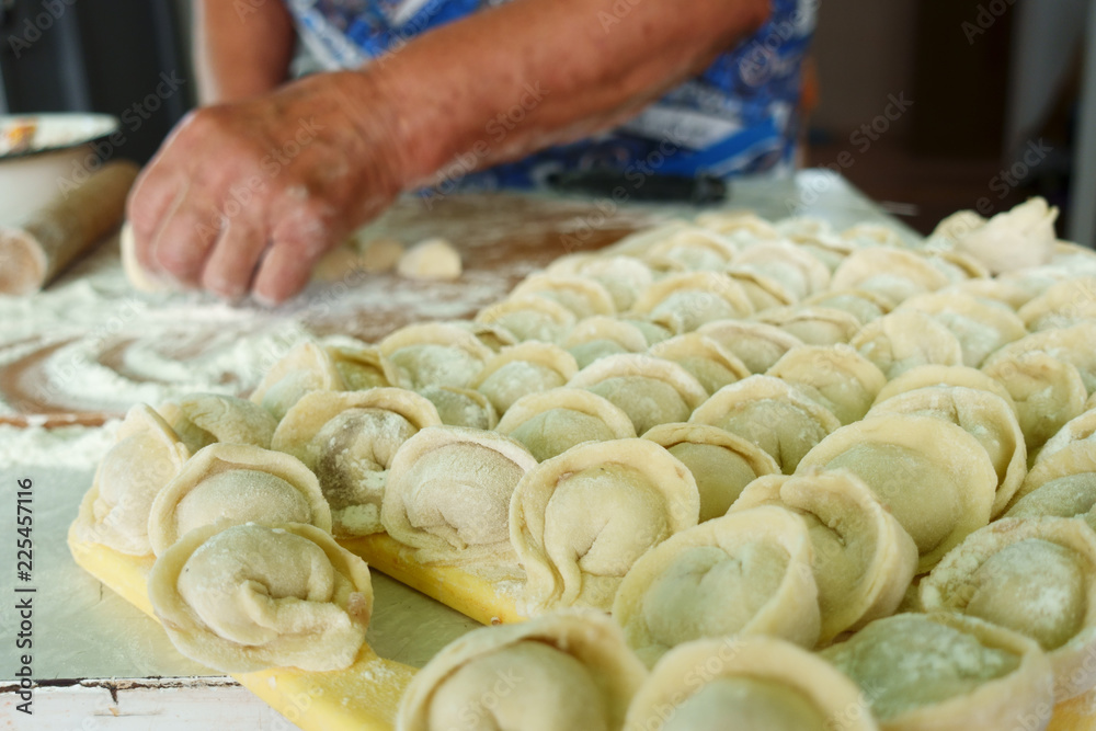 Home-made recipe for dumplings (raviol)i. Traditionally, women of the older generation mold the dumplings in the family.