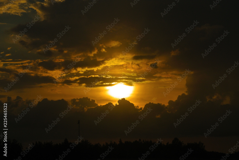 cumulus clouds at sunset