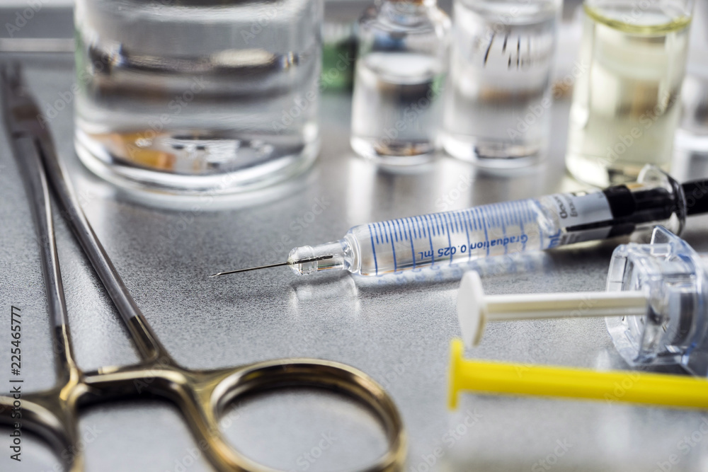 Surgical scissors along with several roads to be injected into a hospital Surgical scissors along with several roads to be injected into a hospital