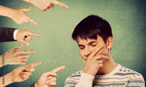 Blaming you. Anxious man judged by different photo