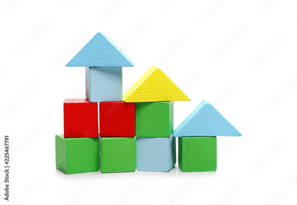 Wooden building blocks for children, made into houses isolated on white background Wooden building blocks for children, made into houses isolated on white background