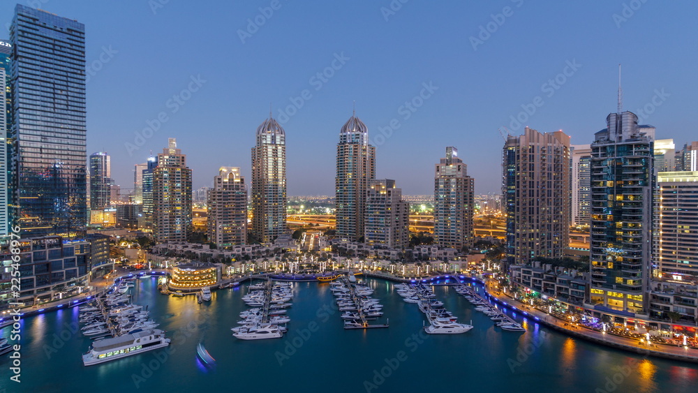 Dubai Marina skyscrapers aeral day to night timelapse, port with luxury yachts and marina promenade