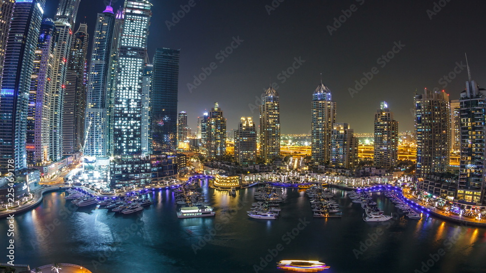 Dubai Marina at night timelapse, Glittering lights and tallest skyscrapers during a clear evening Dubai Marina at night timelapse, Glittering lights and tallest skyscrapers during a clear evening