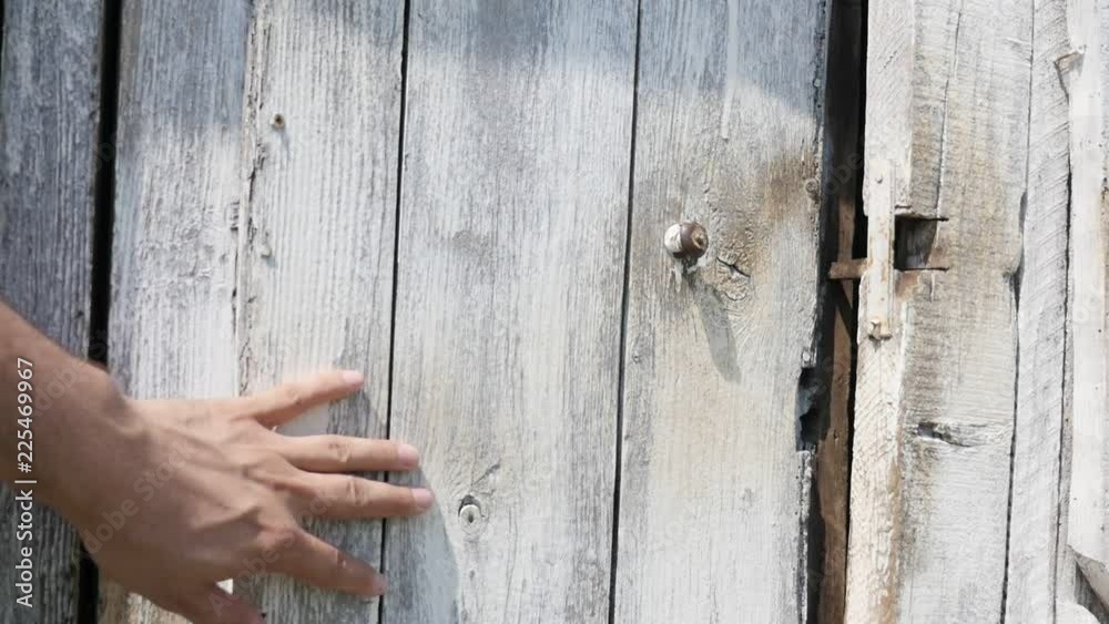 Water well house doors made of planks  slow-mo footage