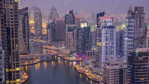 Beautiful aerial top view day to night transition timelapse of Dubai Marina canal