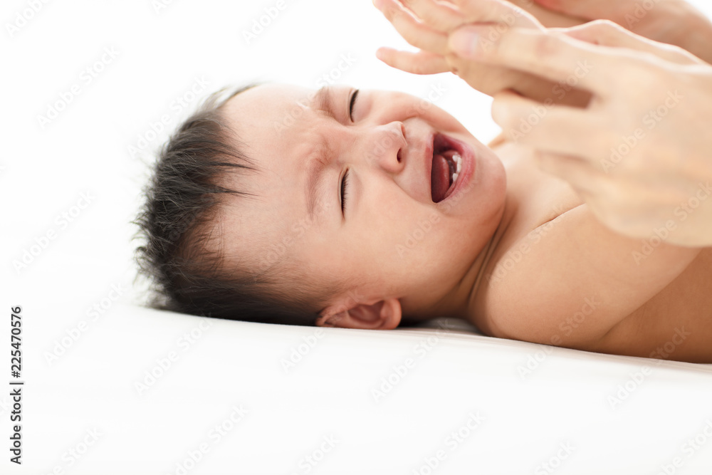 Beautiful baby crying and lying on the bed Beautiful baby crying and lying on the bed