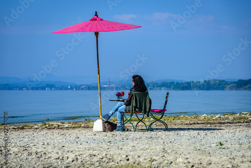 Woman ejoying the last summer days at lake constance