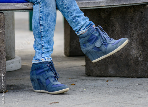 Blue wedge sneakers with jeans