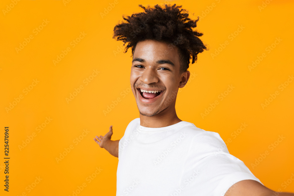 Positive young african man in t-shirt Positive young african man in t-shirt