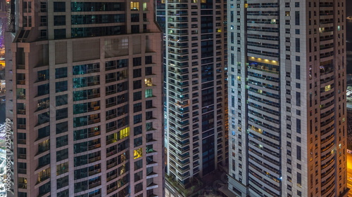 Scenic glowing windows of skyscrapers at night timelapse