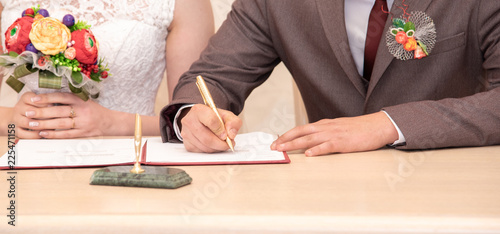 A man signs a marriage contract