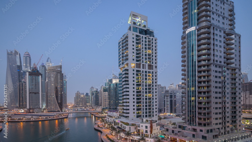 Beautiful aerial top view day to night transition timelapse of Dubai Marina canal