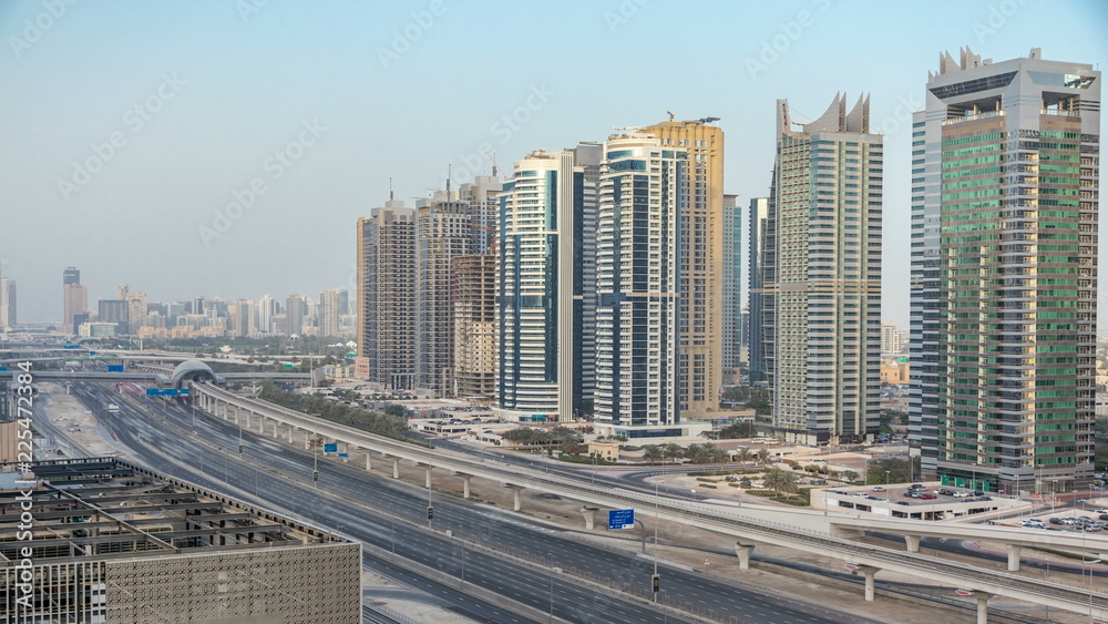Amazing rooftop view on Sheikh Zayed road surrounded Dubai Marina and JLT skyscrapers