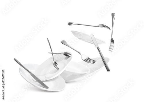 Fall of dishes and cutlery isolated on white background