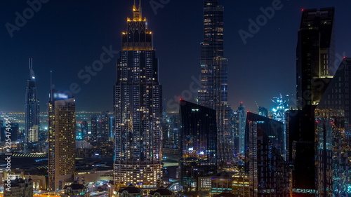 Wallpaper Mural Dubai downtown skyline night timelapse with tallest building and Sheikh Zayed road traffic, UAE Torontodigital.ca