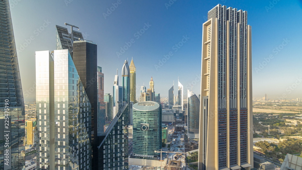 Fototapeta premium Skyline view of the buildings of Sheikh Zayed Road and DIFC timelapse in Dubai, UAE.