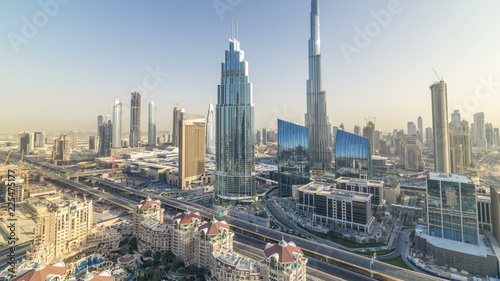 Dubai downtown skyline at sunset timelapse with tallest building and Sheikh Zayed road traffic, UAE