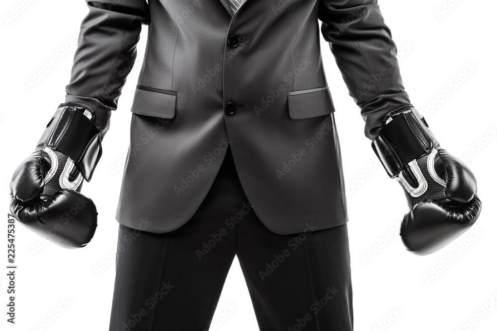 Businessman boxer in black suit wearing sport boxing gloves Businessman boxer in black suit wearing sport boxing gloves