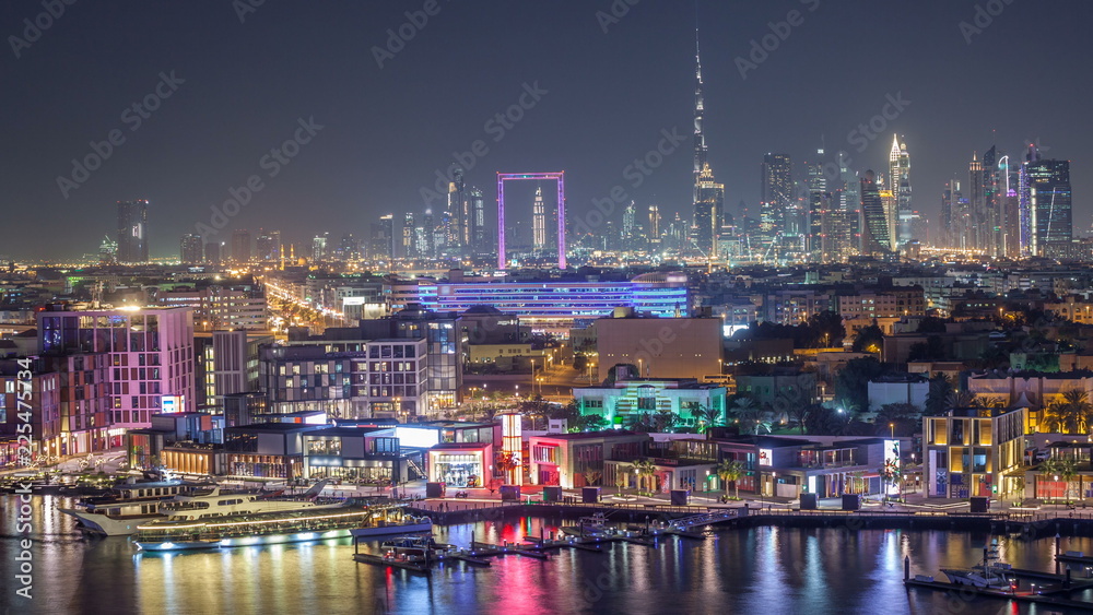 Dubai creek landscape night timelapse with boats and ship near waterfront Dubai creek landscape night timelapse with boats and ship near waterfront