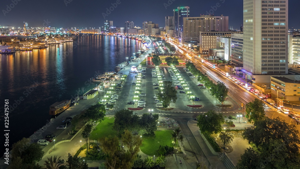 Fototapeta premium Dubai creek landscape night timelapse with boats and ship near waterfront