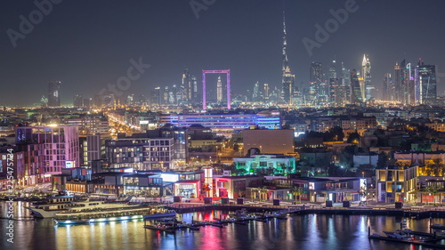 Dubai creek landscape night timelapse with boats and ship near waterfront © neiezhmakov