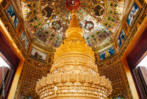 Interior of Thai golden pagodas of Wat Pasawangboon with mural mosaic glass ceiling photo