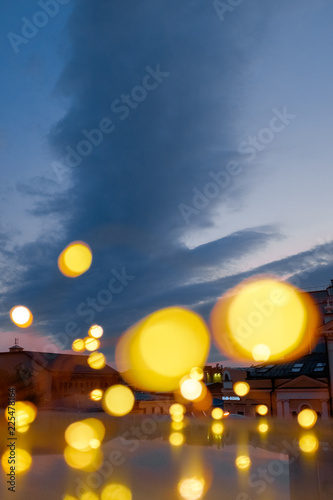 Yellow bokeh. Blurred lights against the backdrop of the city © Oleg Samoylov